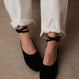 Manu Ballet Flats With Cross Over Ankle Strap Black Suede with a model